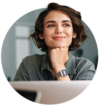 Woman Smiling at Computer