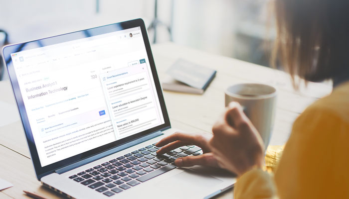 Woman using NEOGOV Insight Smart Recommendations on her laptop